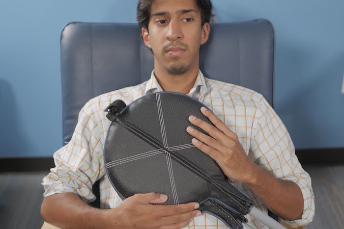 Natural Immune Support with PEMF Man presses PEMF Paddles to his chest