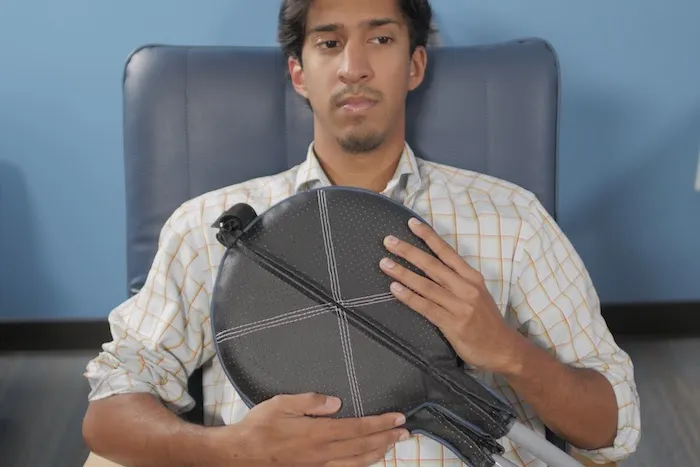 Natural Immune Support with PEMF Man presses PEMF Paddles to his chest