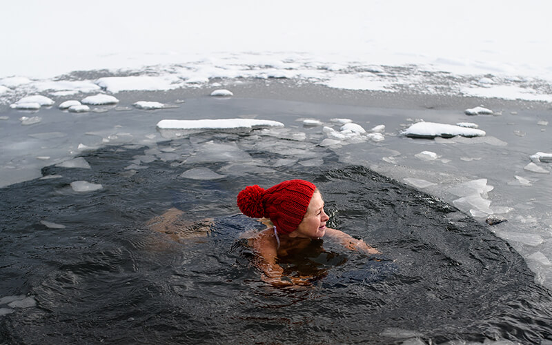How I Used Cold Therapy and PEMF to Adjust to Crossfit woman plunging in snow