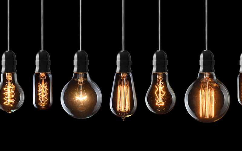 Nikola Tesla's Contribution to Modern PEMF Technology A close-up of a bulb with a glowing filament inside, emitting a warm and soft light.