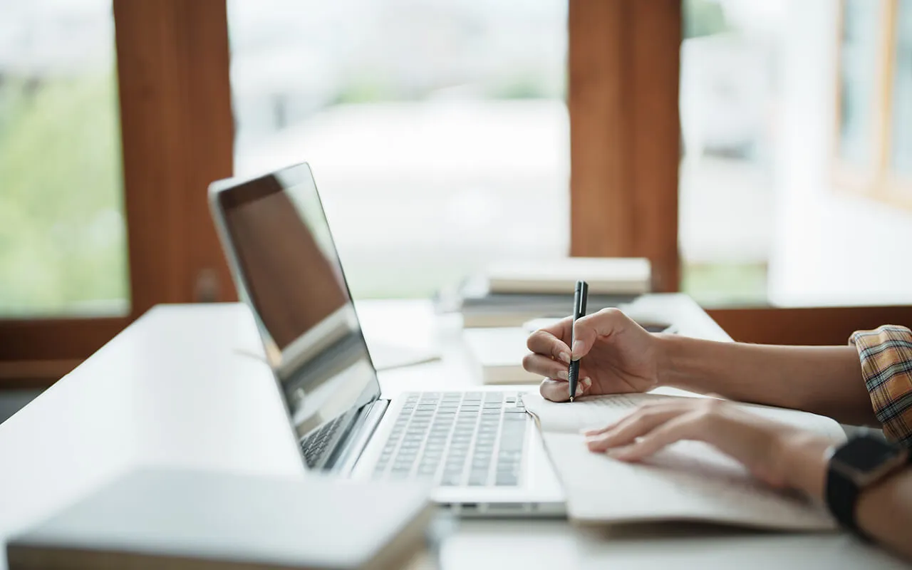 Continuing Your Education: Building Your Animal Expertise Working in a table with a laptop